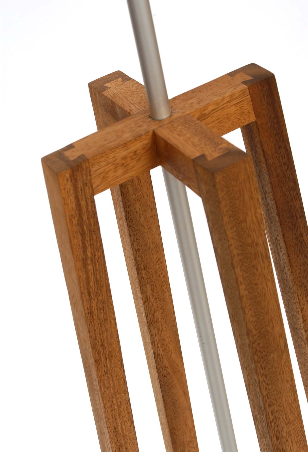 Close up of a wooden lamp stand on a white background