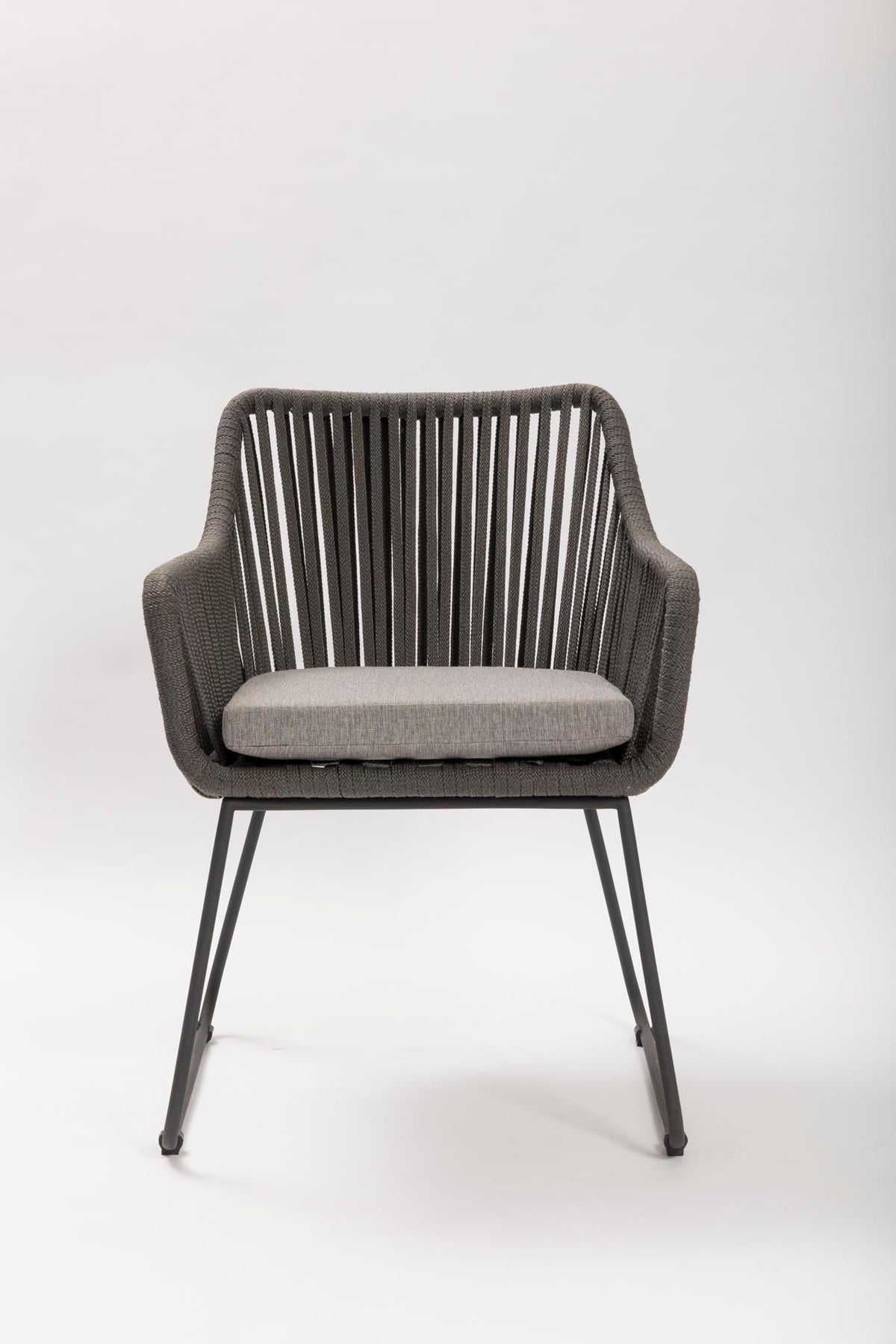 Gray outdoor armchair with a cushion on a white background