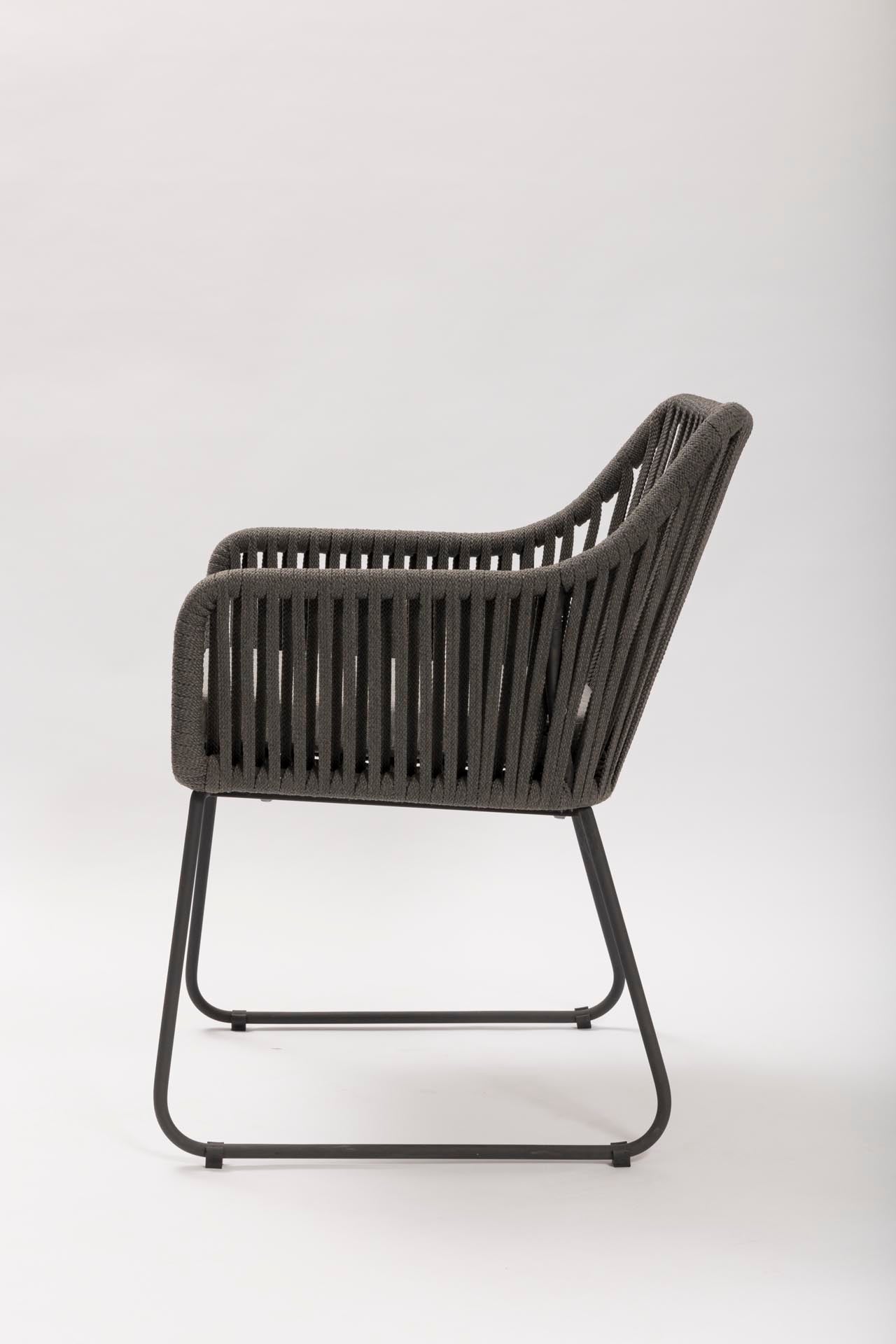 Dark grey wicker chair on a white background