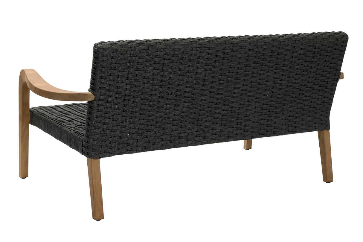 A modern outdoor loveseat with a black woven wicker seat and backrest, featuring light natural wood armrests and legs, shown from a three-quarters angle on a white background.