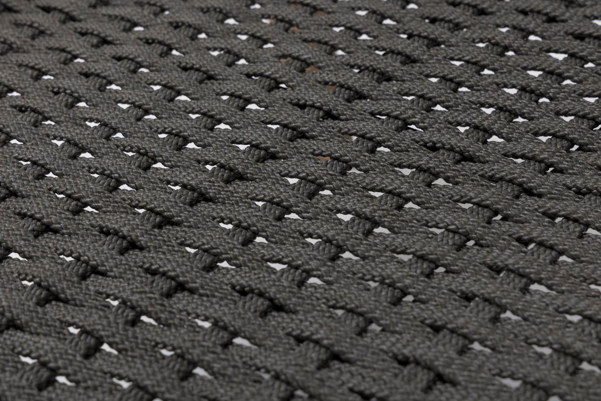 Close-up of a dark grey woven fabric texture with a repeating basketweave pattern.