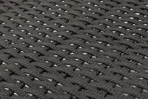 Close-up of a dark grey woven fabric texture with a repeating basketweave pattern.
