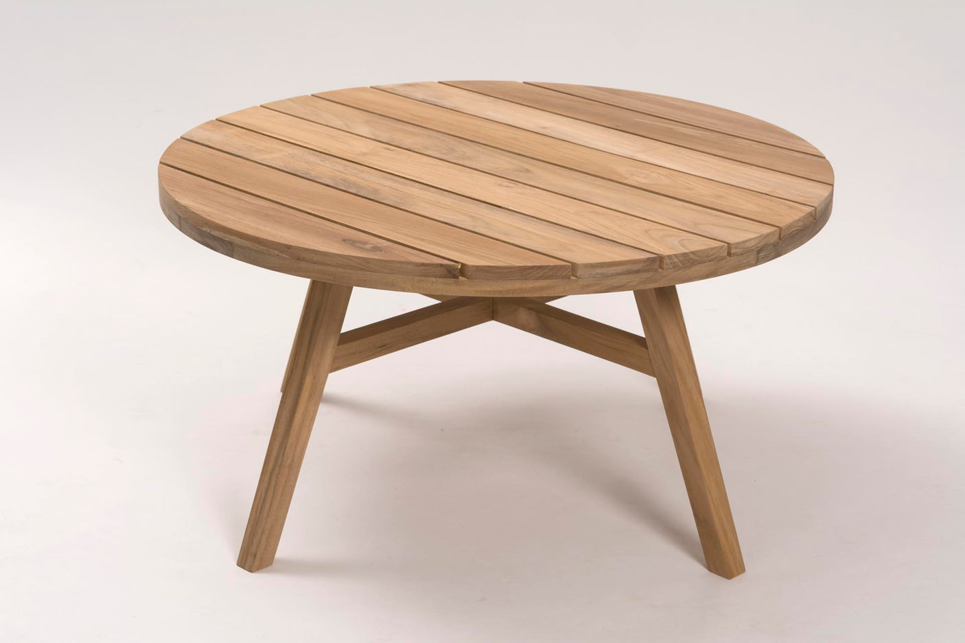 Round wooden table on a white background