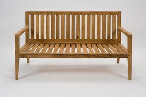 A wooden outdoor bench with a slatted backrest and seat, featuring armrests and a natural oak finish, photographed against a seamless white background.