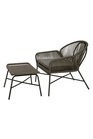 Outdoor dark grey wicker easy chair with footstool on a white background