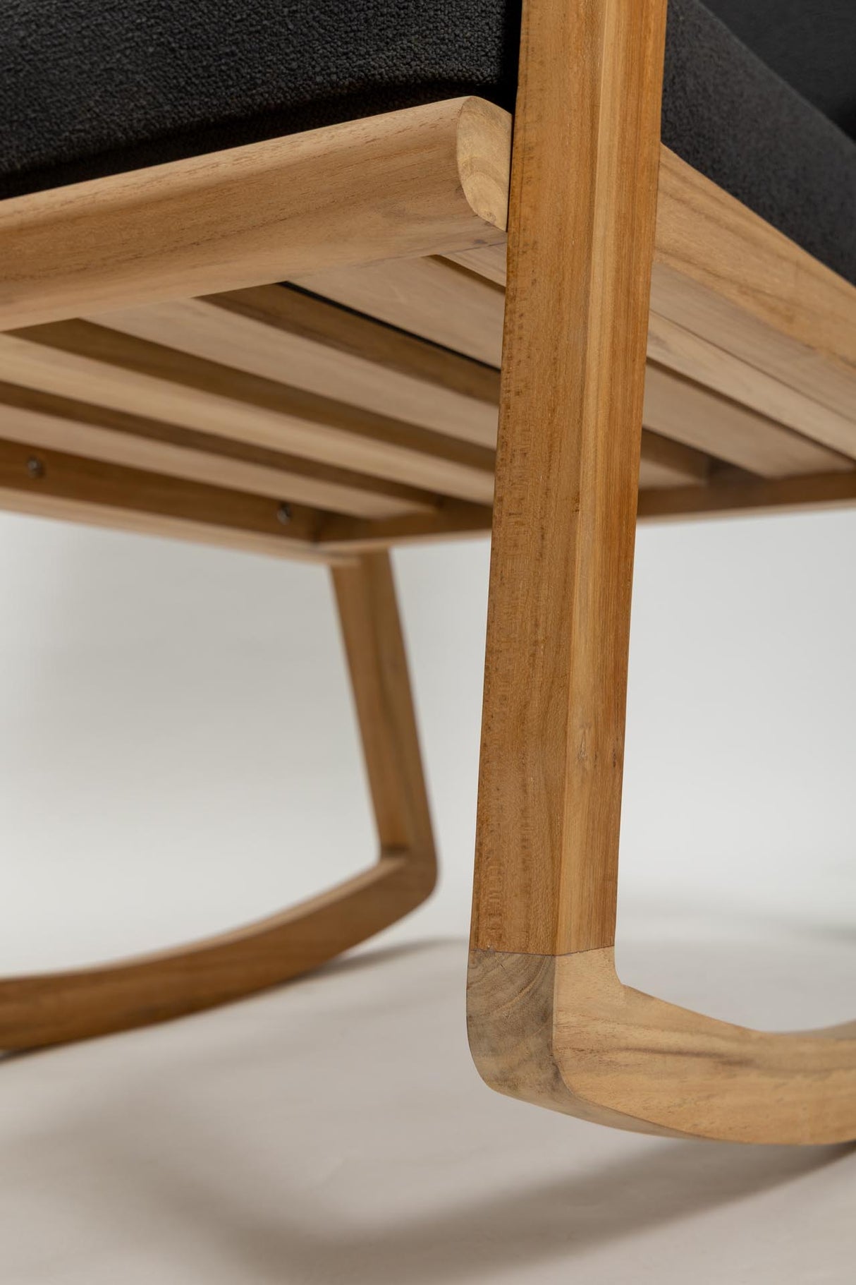 Close-up of a wooden chair with a blurred background