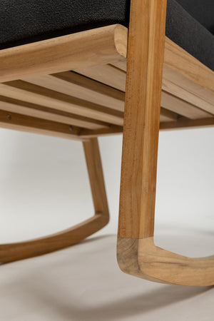 Close-up of a wooden chair with a blurred background