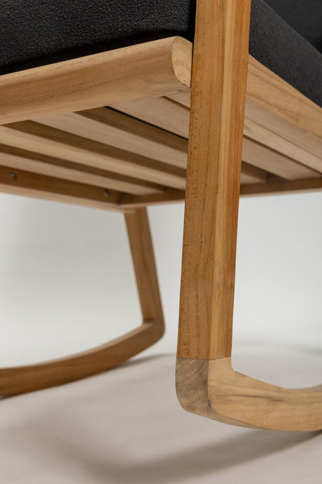 Close-up of a wooden chair with a blurred background