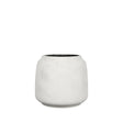 A small cylindrical white ceramic planter with a textured matte finish and a dark interior, centered on a plain white background.