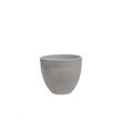 A light grey round outdoor planter against a white background