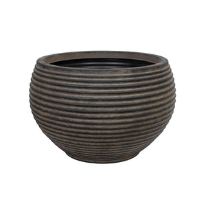 An extra large dark brown outdoor planter with a ribbed brown finish on a white background