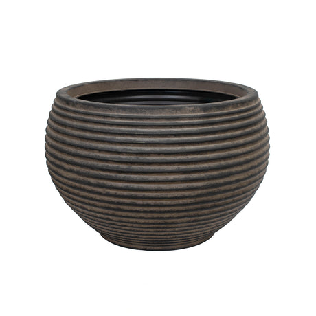 An extra large dark brown outdoor planter with a ribbed brown finish on a white background