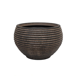 A large dark brown outdoor planter with a ribbed texture against a white background