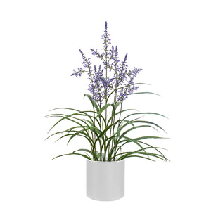 Artificial lavender plant with delicate purple flowers and green foliage in a white pot on a white background